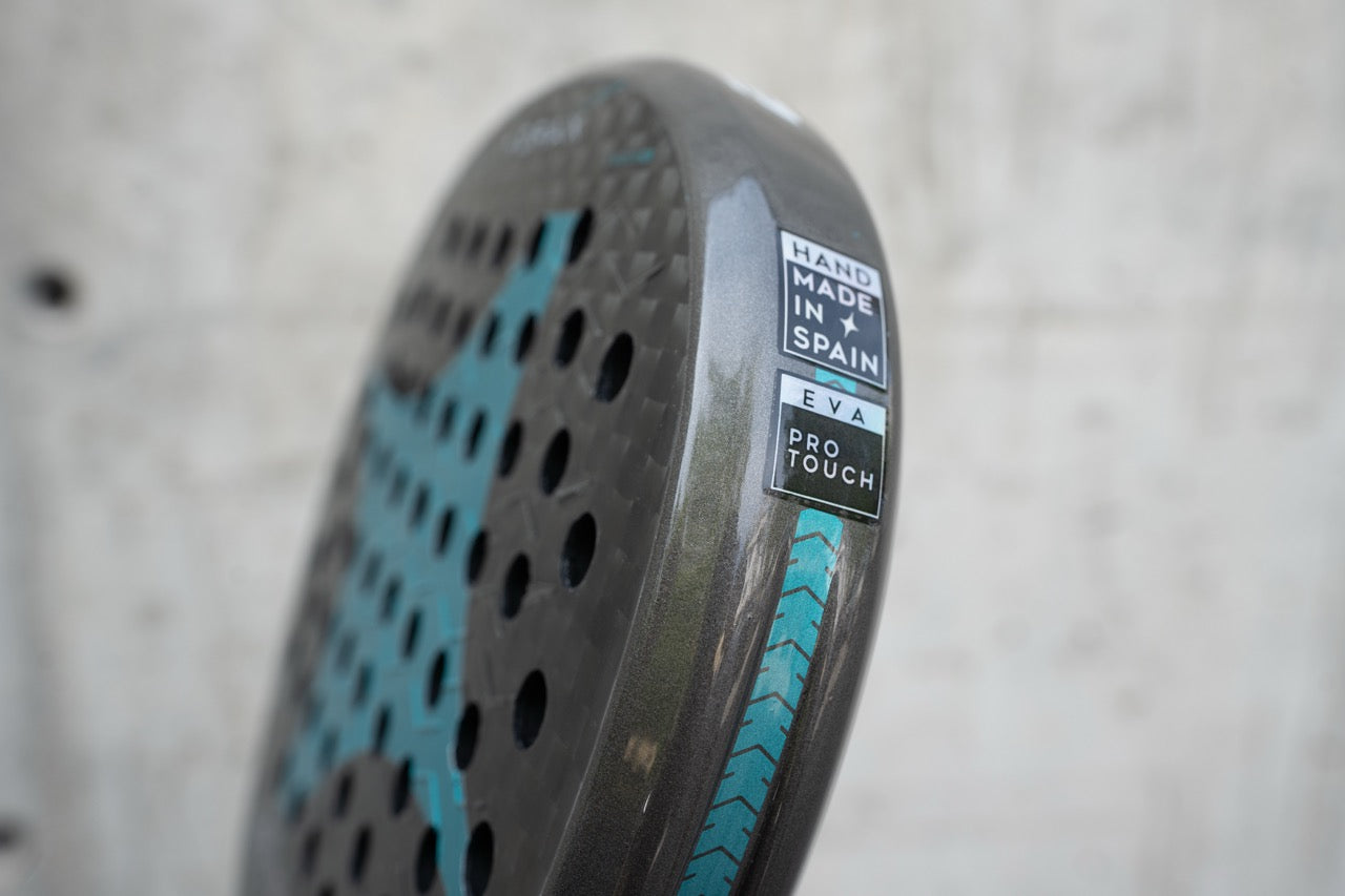 Side view of the StarVie Drax Pro Touch padel racket, highlighting its Pro Touch rubber and 'Handmade in Spain' certification.