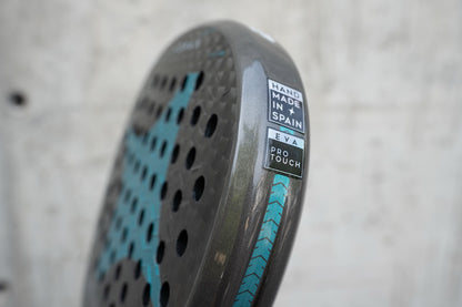 Side view of the StarVie Drax Pro Touch padel racket, highlighting its Pro Touch rubber and 'Handmade in Spain' certification.